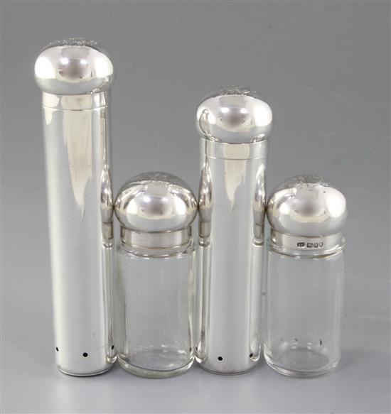 Four late Victorian dressing table cylindrical jars, tallest 176mm. Weight of silver 10.4oz/325 grams.